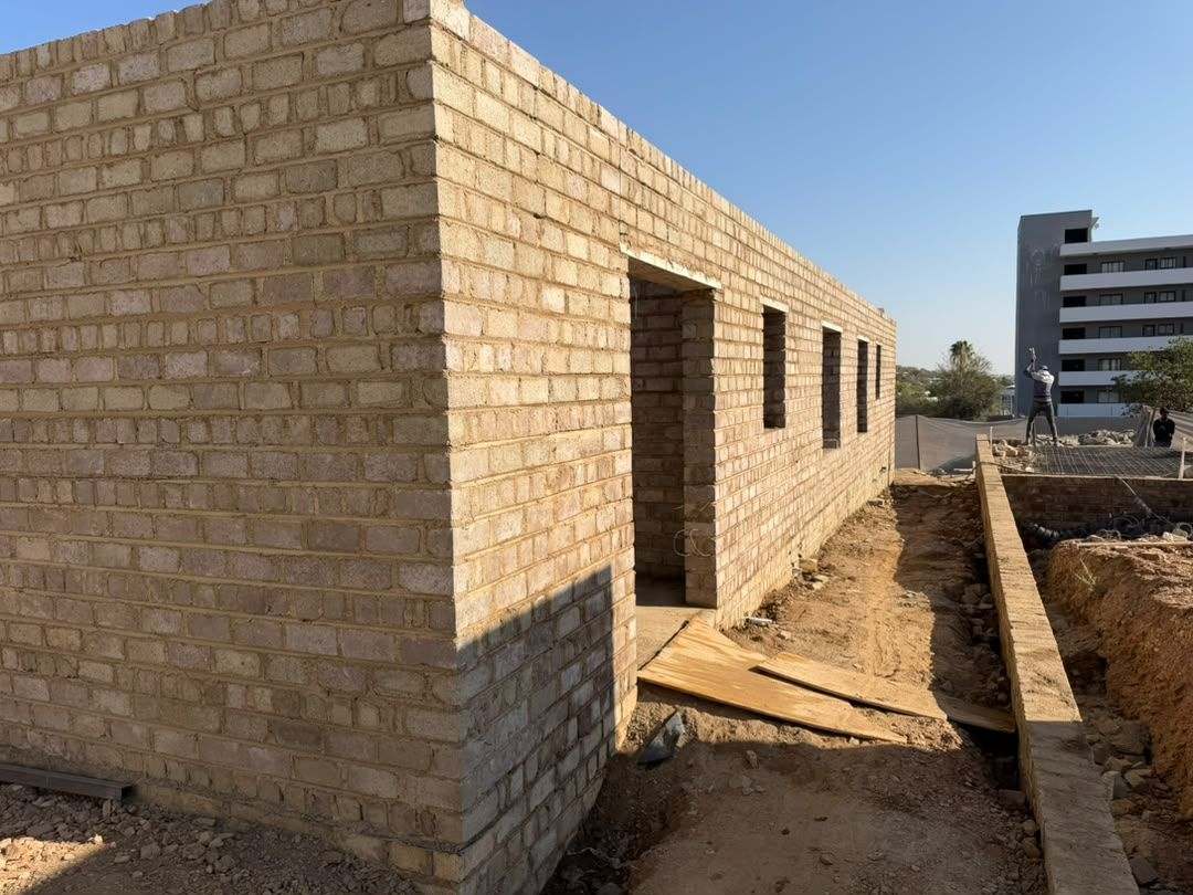 Multi-unit blockwork development rising with Windhoek buildings behind